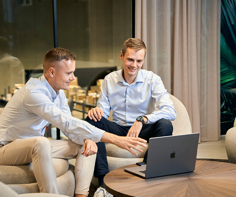 Kasper and Mikkel looking at computer